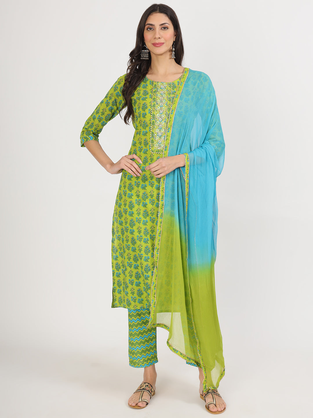 Woman in vibrant green floral print cotton kurta pants and dupatta from Unicorn Fashion