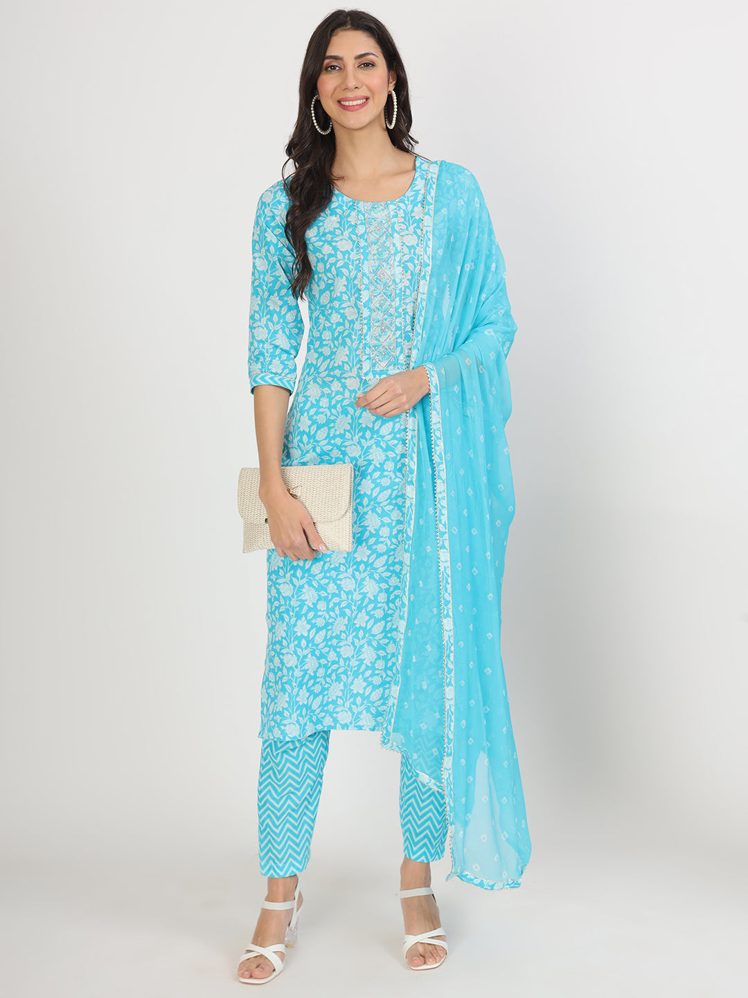 Woman in turquoise blue floral print cotton kurta set for women with matching dupatta