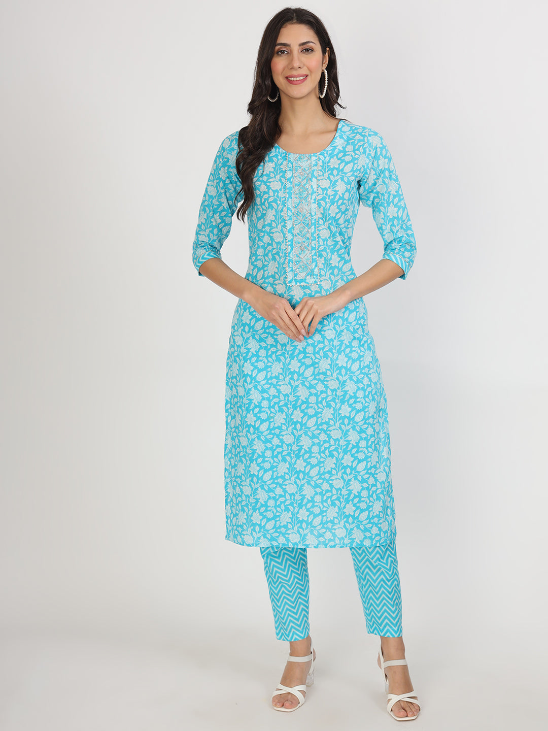 Turquoise blue floral print cotton kurta set for women with pants displayed on model