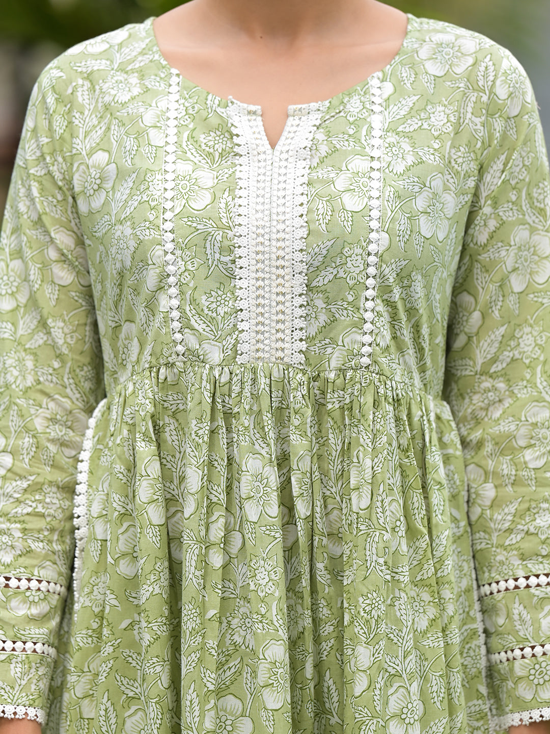 Light green floral dress with white embroidery from the Green Floral Print Cotton Nyra Cut Kurta Pant Set