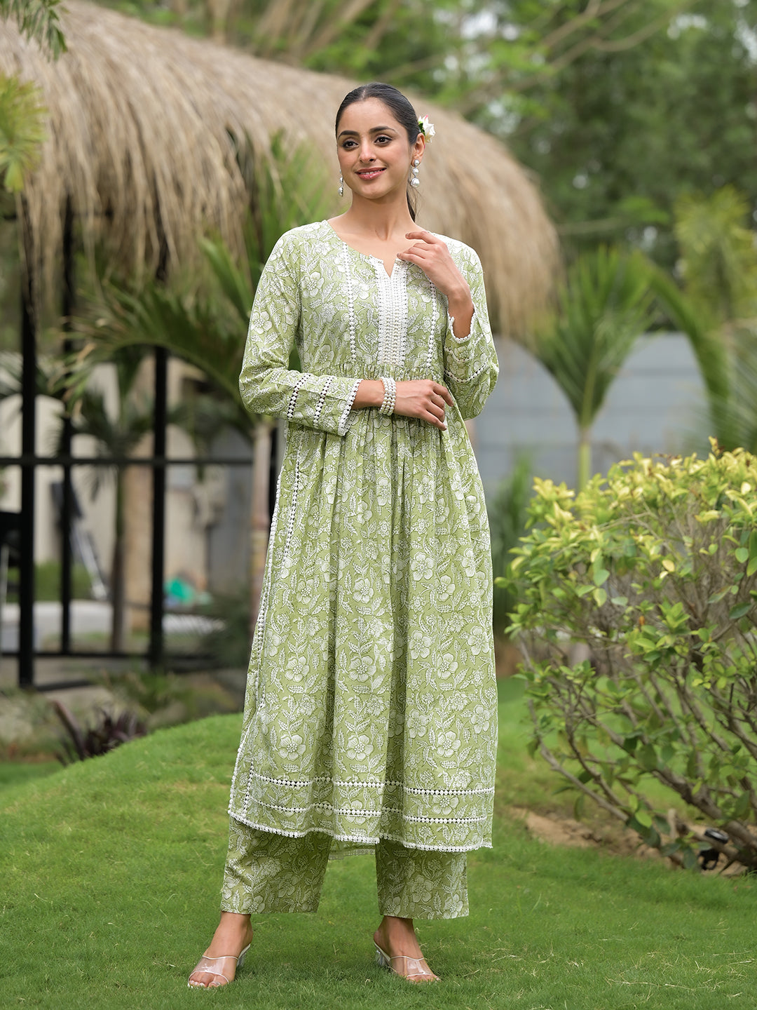 Woman wearing a Light Green Floral Print Cotton Nyra Cut Kurta Pant Set