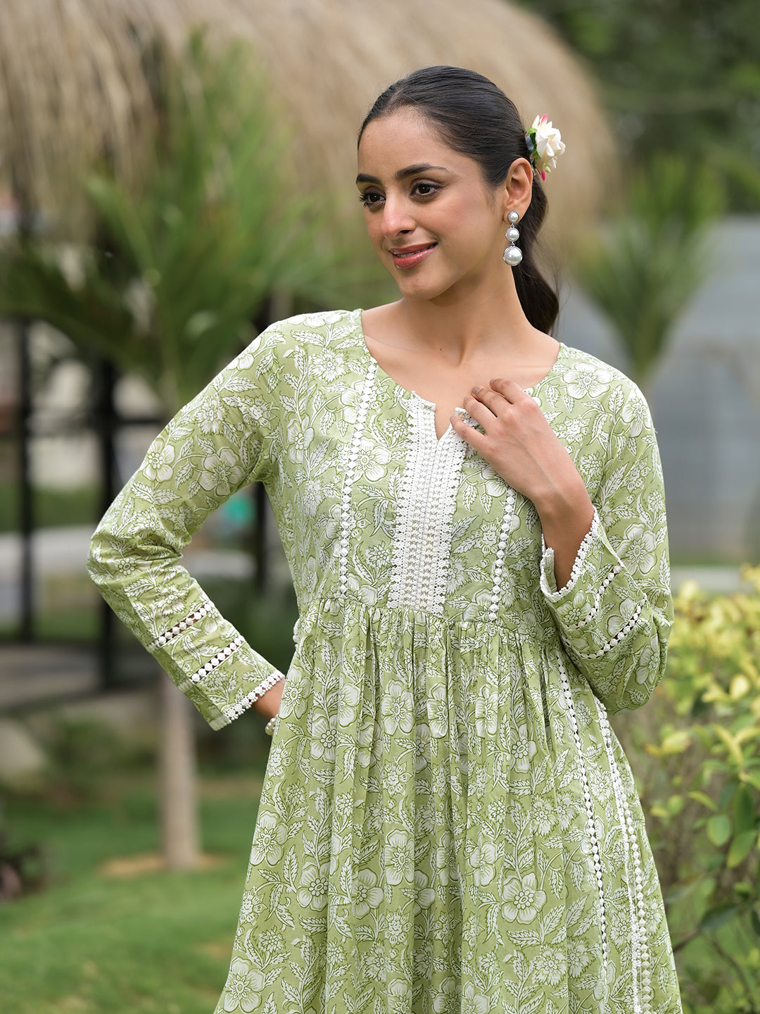 Light green floral print cotton Nyra Cut Kurta Pant Set with white embroidery and long sleeves