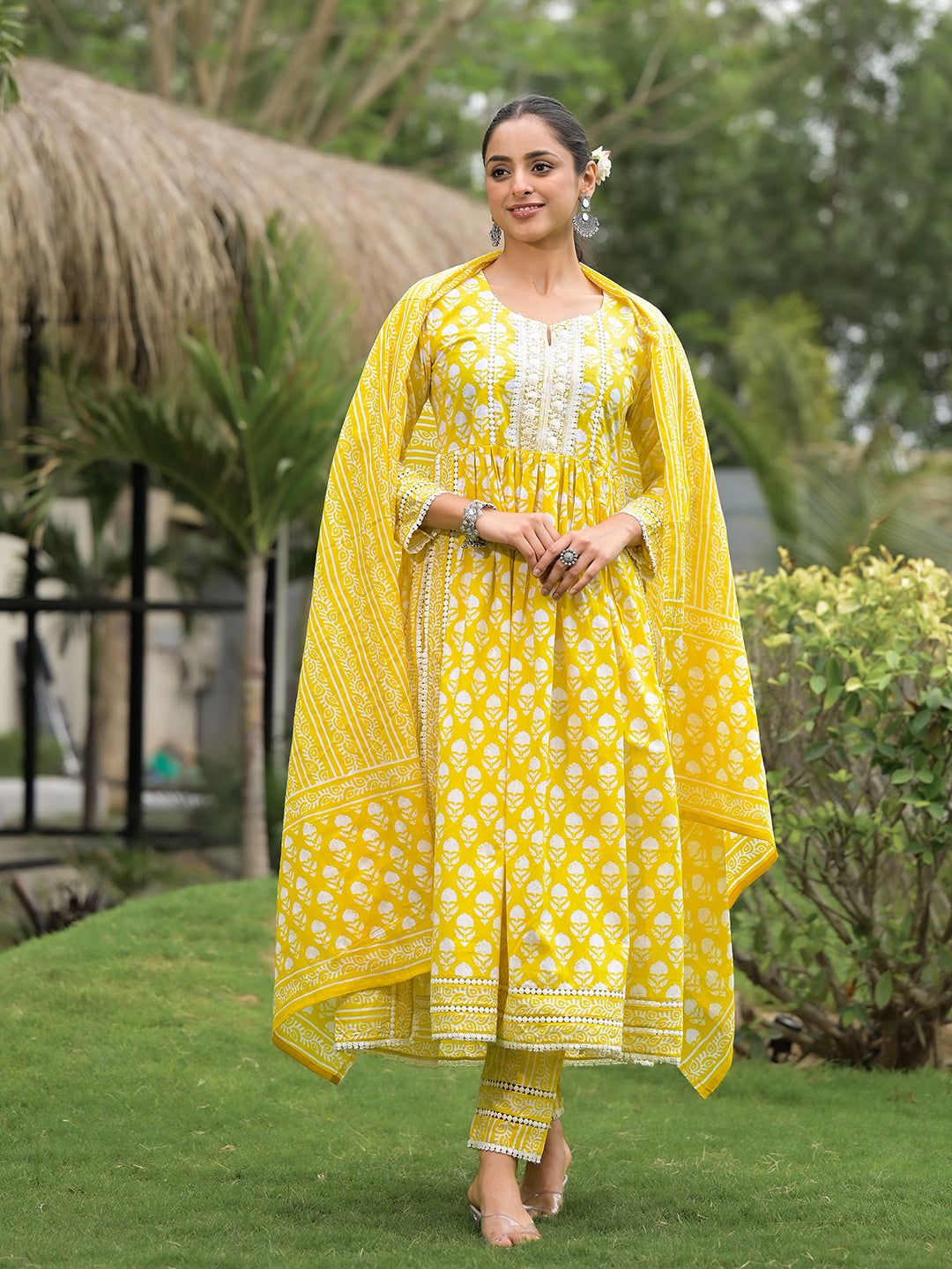 Bright yellow floral print cotton kurta with cape overlay and matching pants set for women