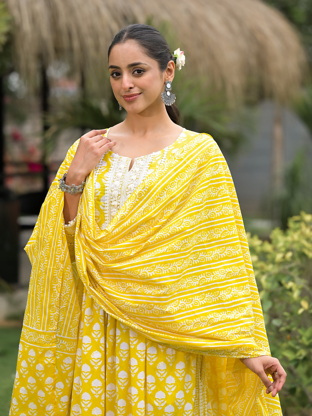 Woman in vibrant Yellow Floral Print Cotton Kurta Pants with Dupatta showcasing intricate embroidery