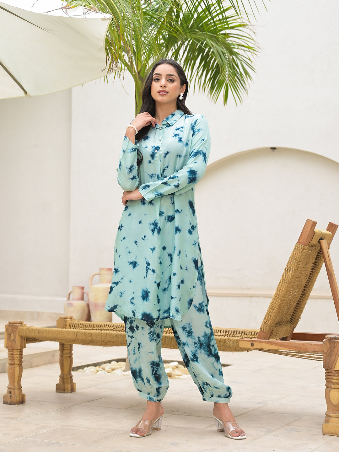 Light blue floral print salwar kameez outfit worn by a woman.