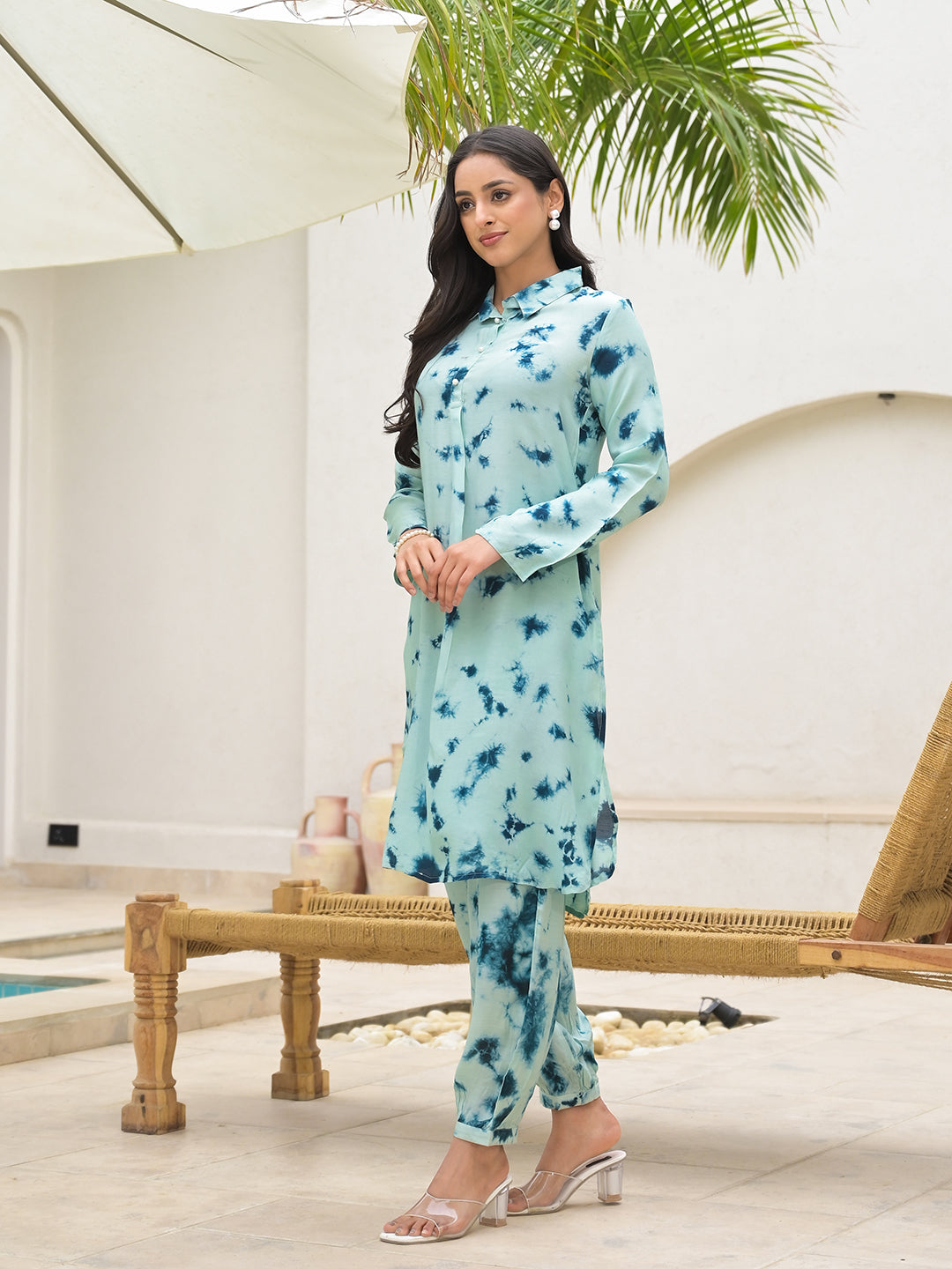 Light blue floral print kurta and pants set worn by a woman.