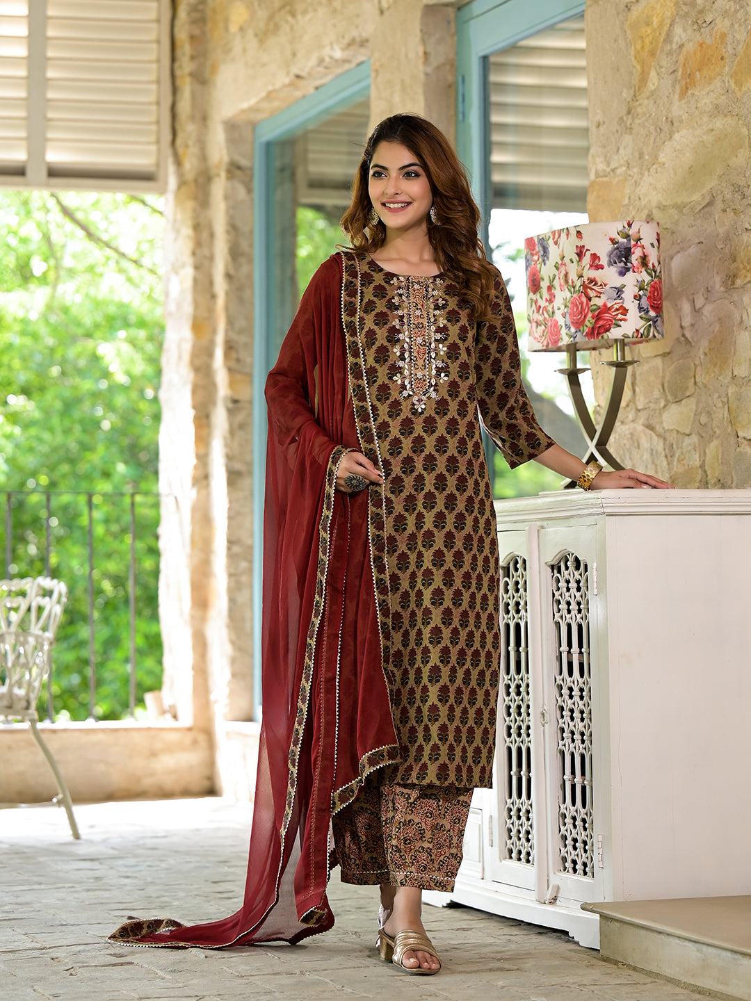 Woman in embroidered brown straight fit zardozi work knee long cotton kurta set