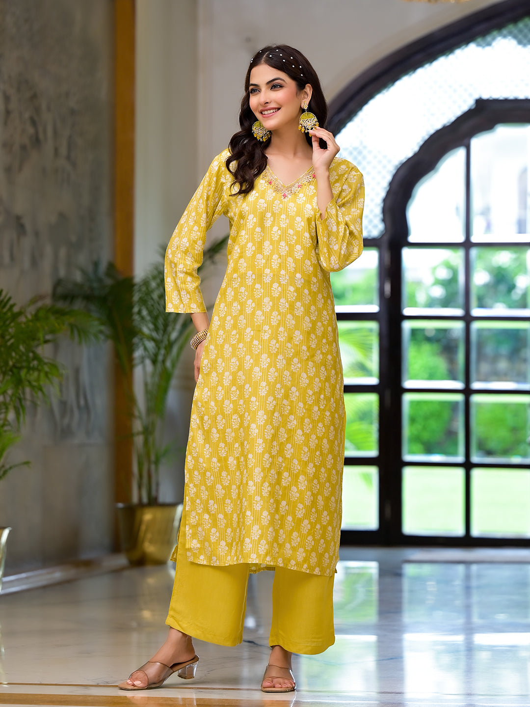 Smiling woman in Yellow Printed Muslin Straight Kurta with matching pants and dupatta