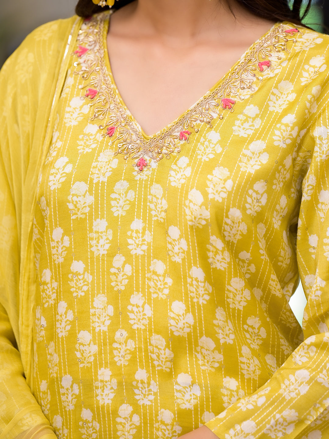 Yellow printed muslin straight kurta with floral patterns and embellished neckline