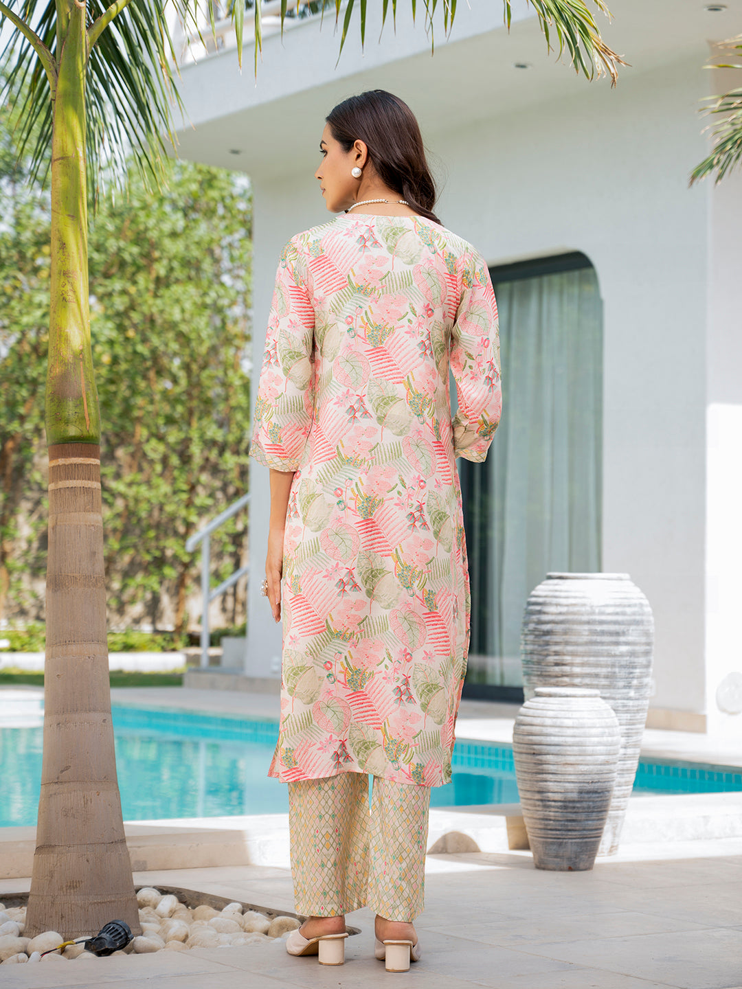 Floral print muslin kurta set with three-quarter sleeves over pale trousers