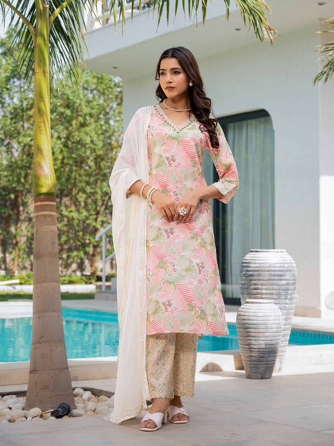 Woman in floral print muslin kurta set featuring pink and white embroidery design