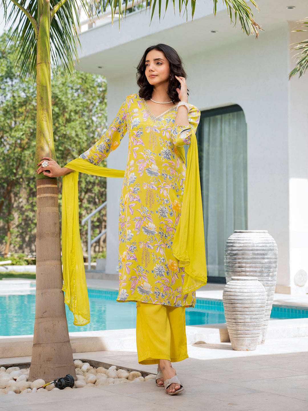 Bright yellow embroidered floral print Muslin Kurta Set worn by a woman