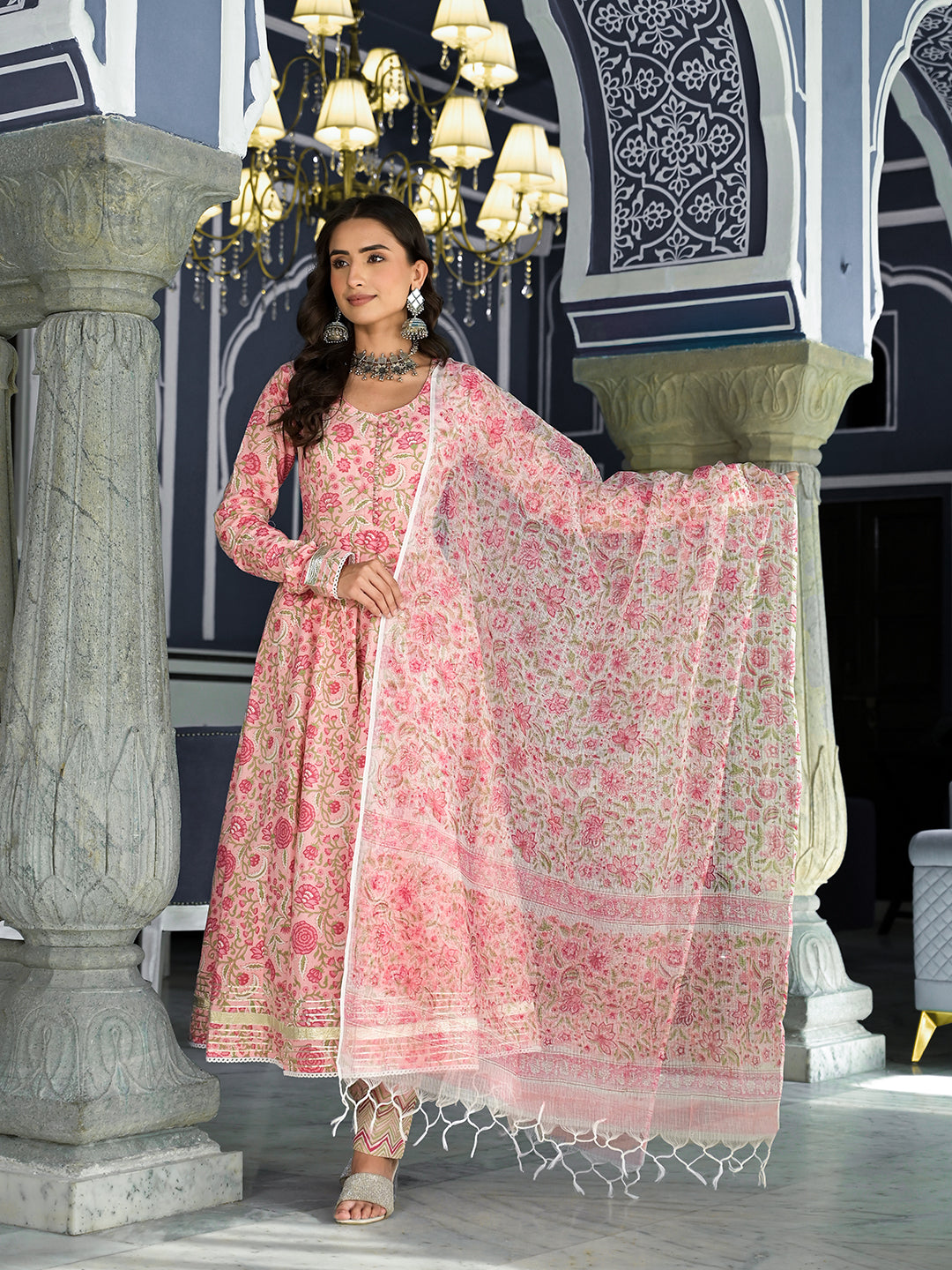 Woman in a pink floral hand block printed Anarkali Kurta Trouser with a matching dupatta