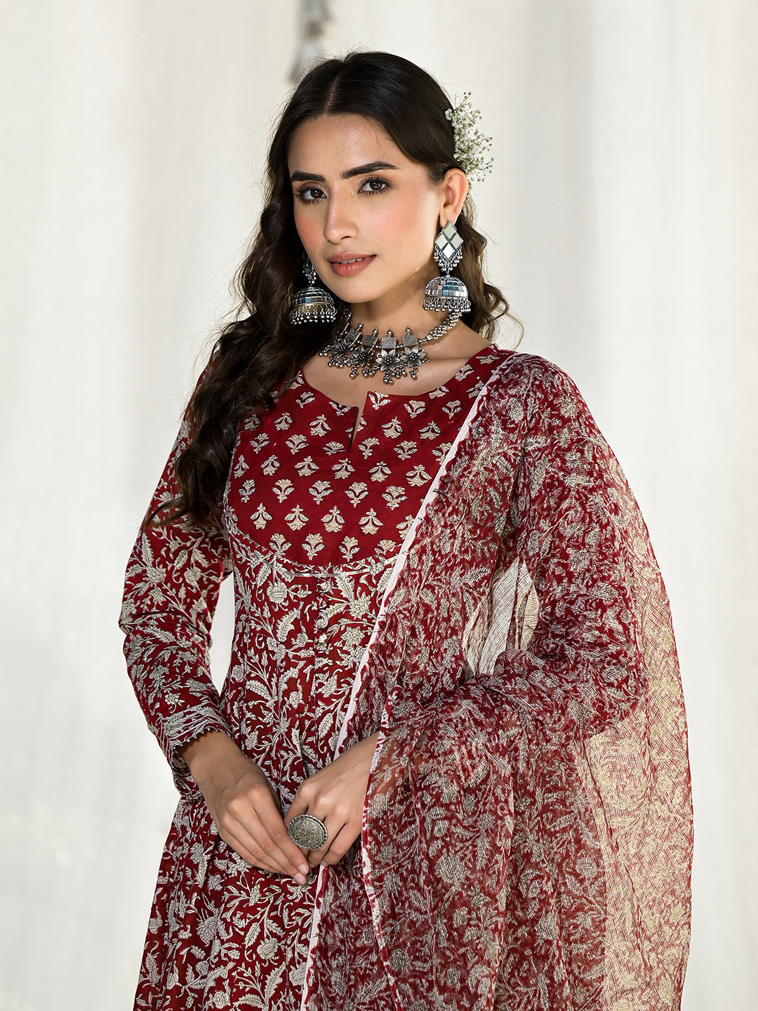 Woman in ornate red and silver jewelry wearing Maroon Floral Printed Anarkali Cotton Kurta