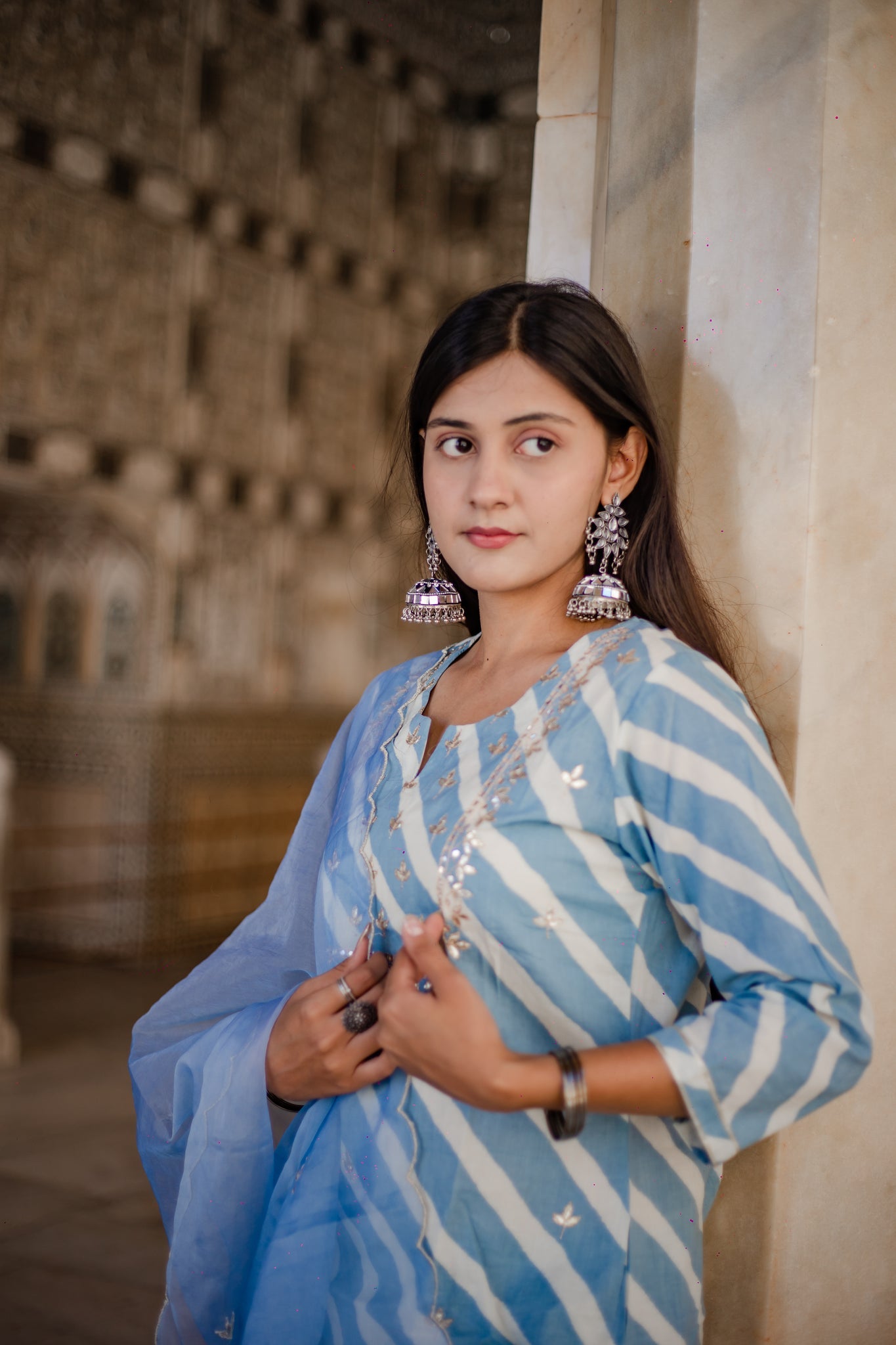 Woman in a blue and white striped outfit featuring Sky Blue Leheriya Cotton Kurta with Organza Dupatta