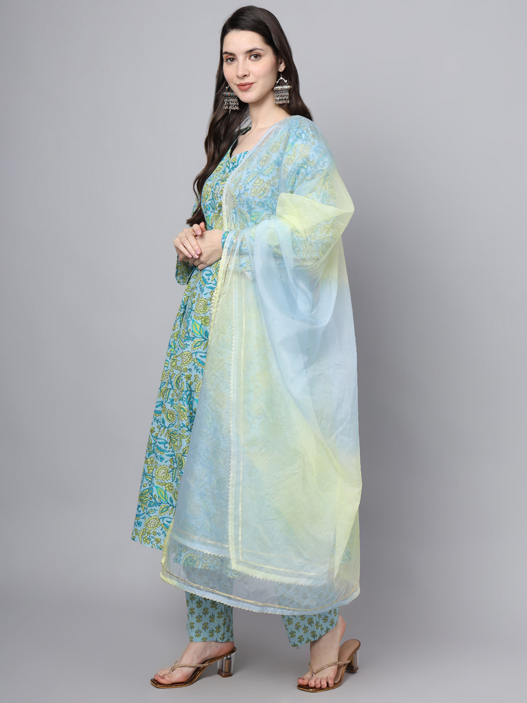 Woman in a light blue cotton Anarkali kurta set with floral prints and sheer dupatta